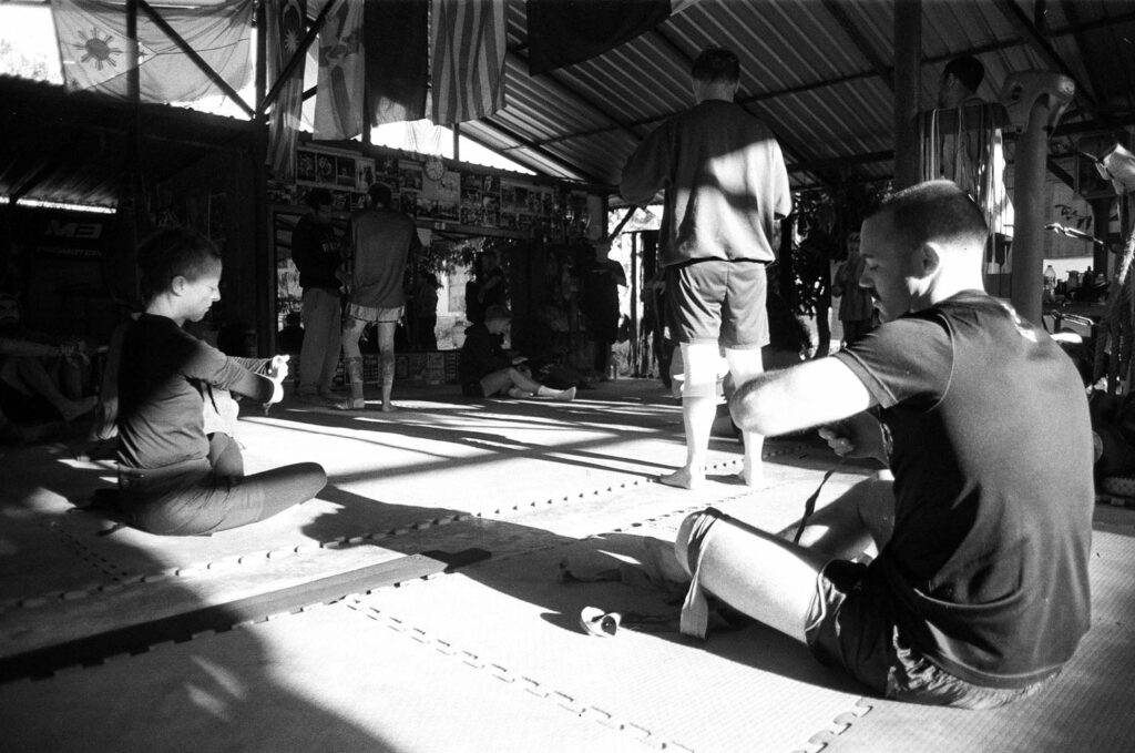 Morning ritual: putting the bandages before the training. Sitjemam Gym - Pai - Thailand / February 2024