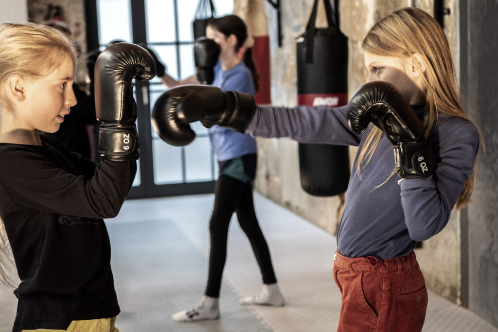 Muay Thai training for kids in Sidekick.
Color photography.