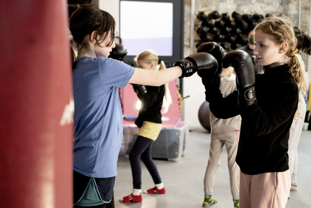 Muay Thai training for kids in Sidekick.
Color photography.